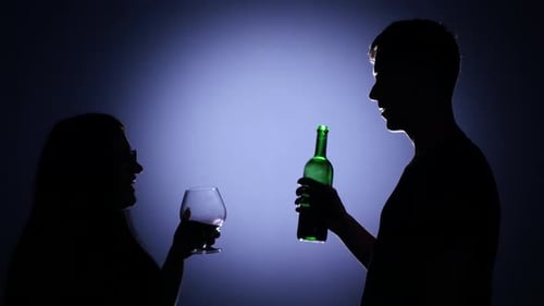 Couple Toasting Wine Glass. Back Light