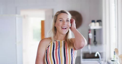 Smiling Woman in Bright Modern Kitchen