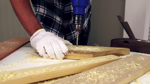 Carpenter Working on Wood Craft at Workshop