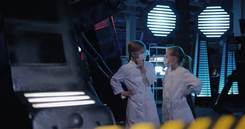 Young Technicians Discuss the Space Installation
