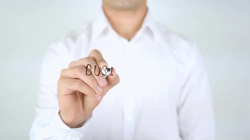 Man Writes Business Efficiency with a Marker