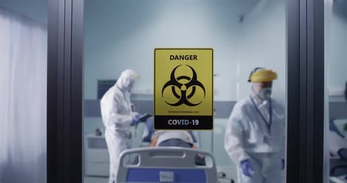 Hospital Room with Patient and Medical Staff