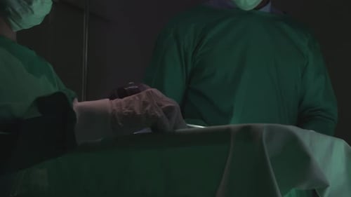 Surgeons Perform Medical Procedure in Operating Room