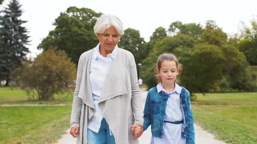 Grandmother and Granddaughter Walking at Park