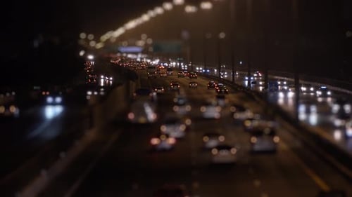 Blurred Car Headlights on a Busy Highway at Night