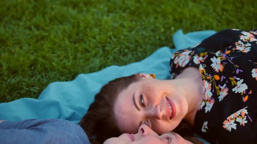 Romantic Couple Lying on Blanket in Grassy Park