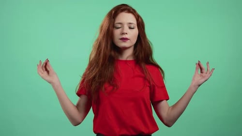 Auburn Haired Woman Meditating in Studio