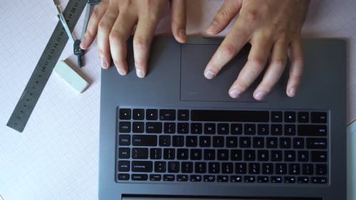 Crop Architect Using Laptop on Draft