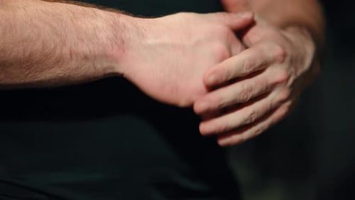 Man Stretches and Exercises Sore Hands
