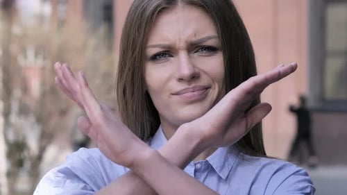Woman Makes a Stop Gesture with Her Arms