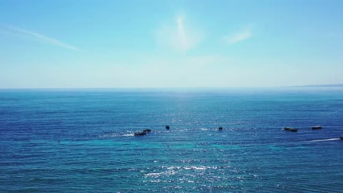 Natural fly over copy space shot of a white sand paradise beach and turquoise sea background in vibr