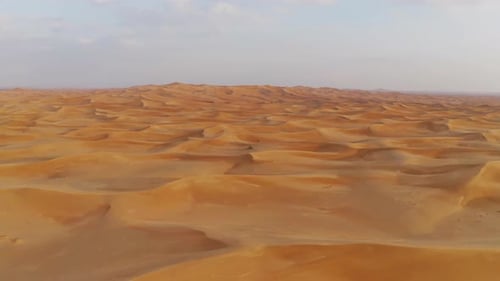 Aerial view of red Desert Safari with sand dune in Dubai City, United Arab Emirates or UAE