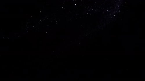 Sparkling Space Particles on Black Background