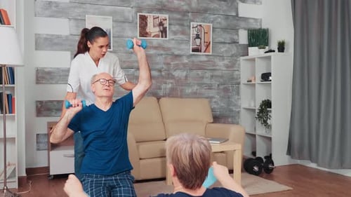 Senior Man Working Out With Hand Weights at Home