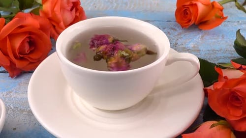 Cup of Floral Rose Tea with Fresh Roses