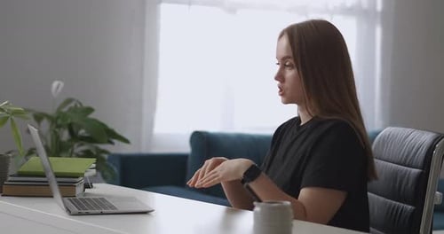Young Woman On Video Call At Desk