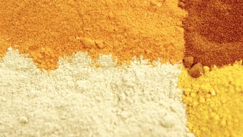 Colorful Spices Piled Neatly in Square Arrangement