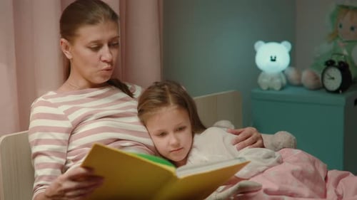 Cozy Mother and Child Reading Bedtime Story