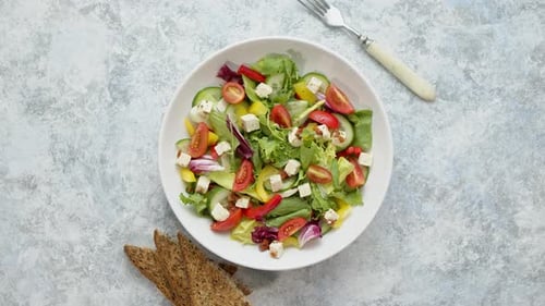 Fresh Salad with Lettuce, Tomatoes, Cucumber, and Cheese