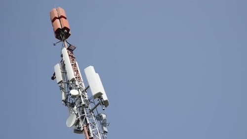 Dish and panel on telecommunication antenna system 4K 3840X2160 UHD slow pan footage - Repeater and