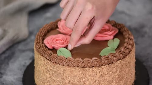 Decorating Chocolate Cake with Candy Leaves and Roses
