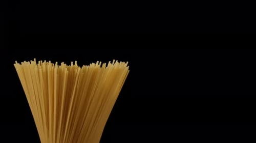Uncooked Spaghetti Close Up on Black Background