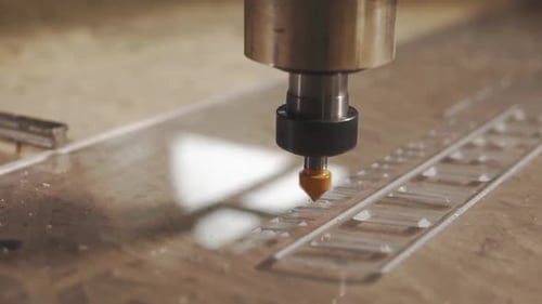 Head of Automatic Machine Is Rotating, Polishing Inscription on Plastic Detail