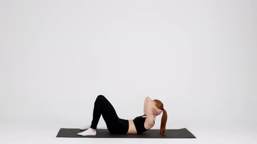 Sporty Young Woman Doing Abs Crunches Exercises Training Abdominal Muscles In Studio