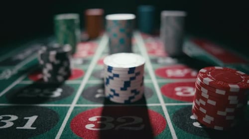 Close Up of Bet Stacks of Chips on a Green Casino Roulette Table