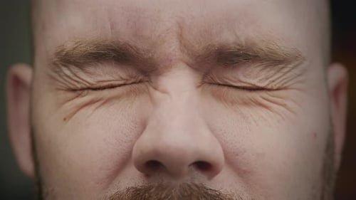 Close Up of Man's Eyes Being Shut and Open in Slow Motion