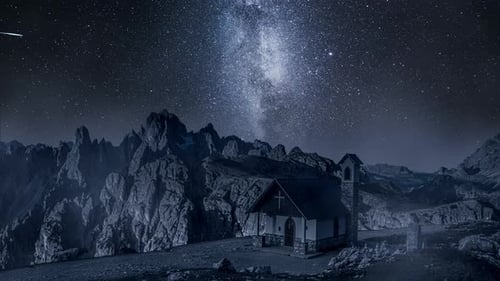 Milky wa over small chapel in Dolomites, Italy