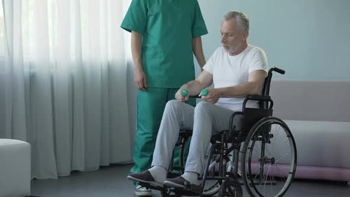 Senior Man Doing Physical Therapy with Dumbbell