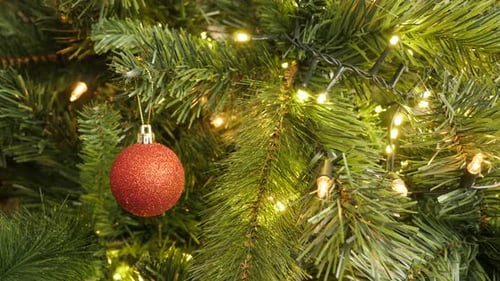 Sparkling lights and shiny bauble close-up 4K 2160p 30fps UltraHD footage - Red Christmas decorative