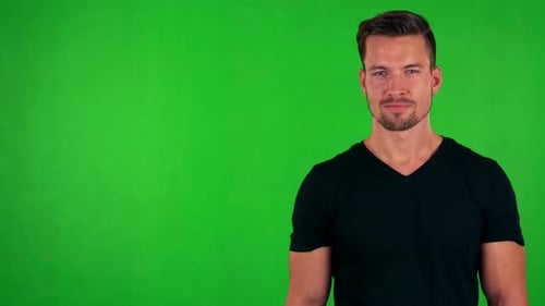 Young Handsome Caucasian Man Agrees (Shakes with Head) - Green Screen - Studio
