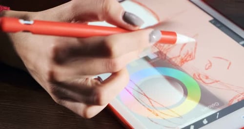 Close Up Female Designer Sitting and Working at Desk. Contemporary Young Woman Drawing and Using Pen