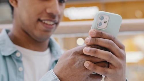 Man Using Smartphone Smiling Close Up