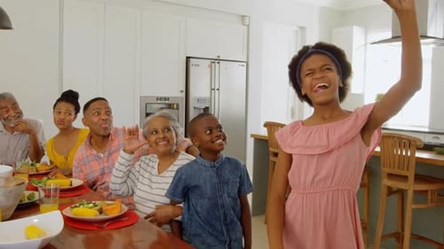 Multi-Generational Family Taking Photo at Dining Table