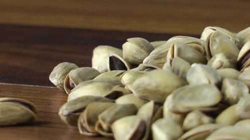 Pile of Pistachios on a Wooden Table