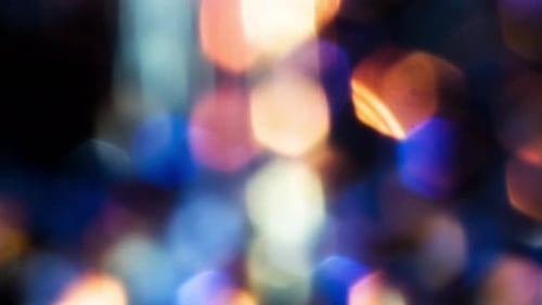 Abstract Bokeh Lights Pulsating in Blue, Gold, and Pink