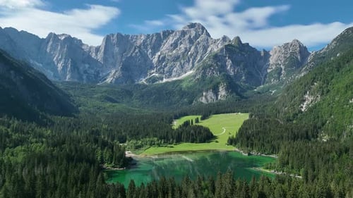 Emerald lake at Fusine with Mangart mountain