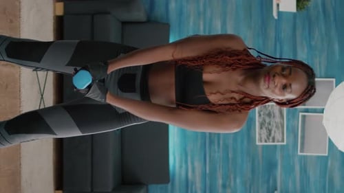 Woman Working Out with Dumbbells at Home