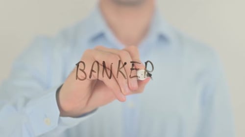 Man Writes the Word "Banker" on Clear Surface