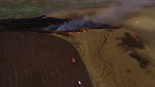 Aerial View of Wildfire Burning Rural Field