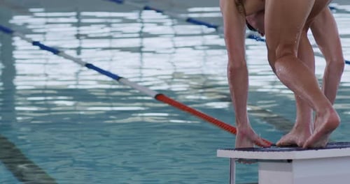 Swimmer diving into the pool