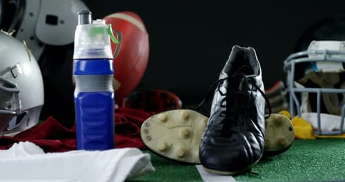 American Football Equipment on Green Field