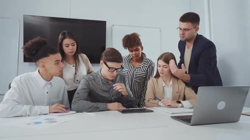 Multiethnic Business Team Discussing New Project in Office
