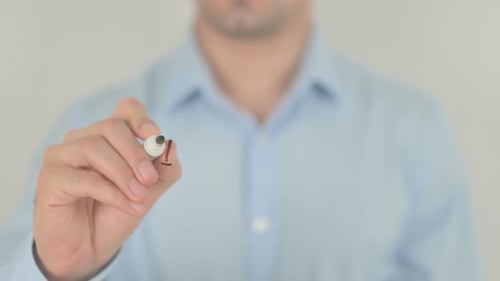Man Writes Word Innovation on Glass Surface