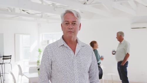 Smiling Man in Bright Modern Office Setting