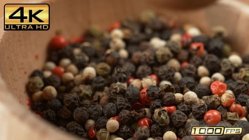 Colorful Peppercorns Being Ground with Mortar and Pestle