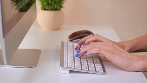Female Fingers with Blue Polish Nail Use PC